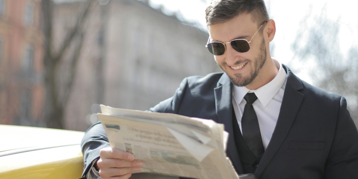 An individual uses a smart news assistant to navigate complex information and stay informed with confidence.
