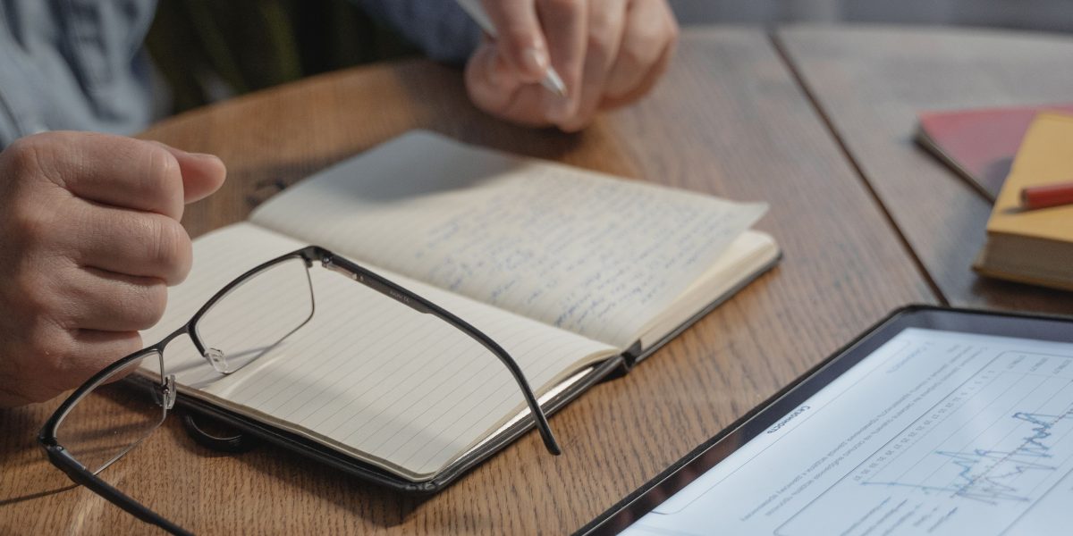 A person deeply focused, evaluating digital content on a tablet, symbolizing the challenge of discerning truth in an age of information overload.