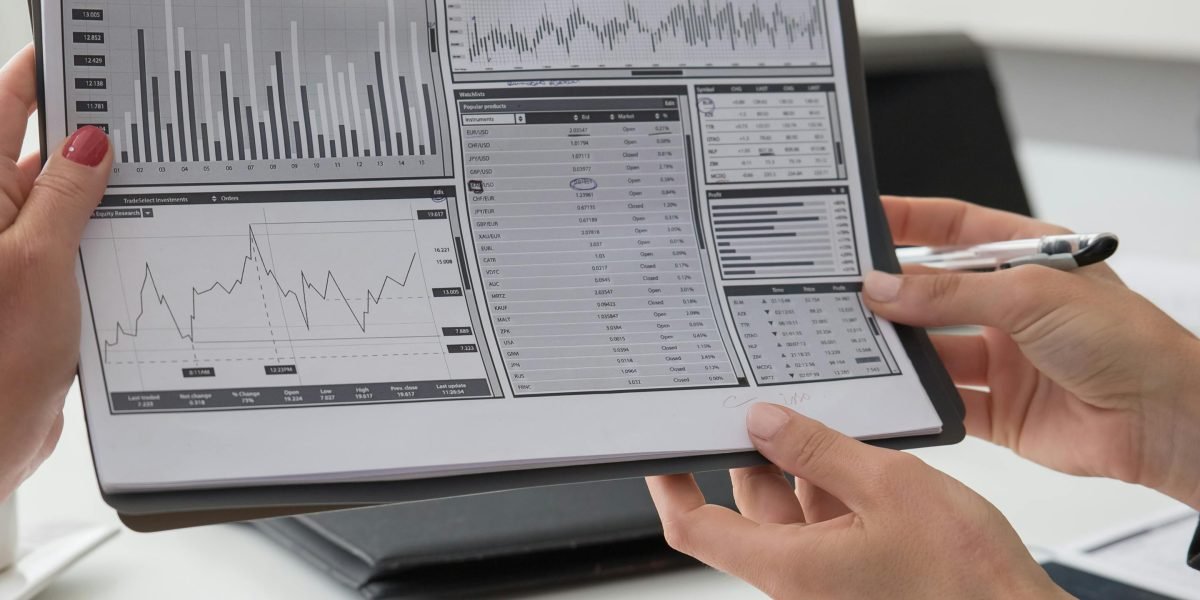 A person diligently analyzing complex information, such as business interests, to understand underlying influences.