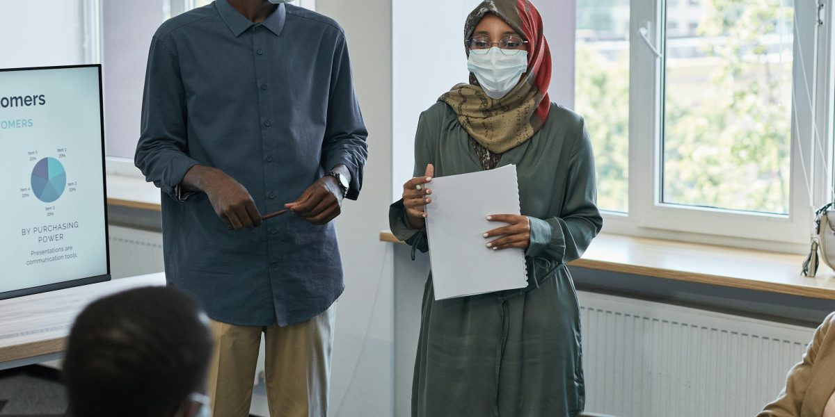 Journalists collaborating to build trustworthy news stories using data and transparent reporting methods.