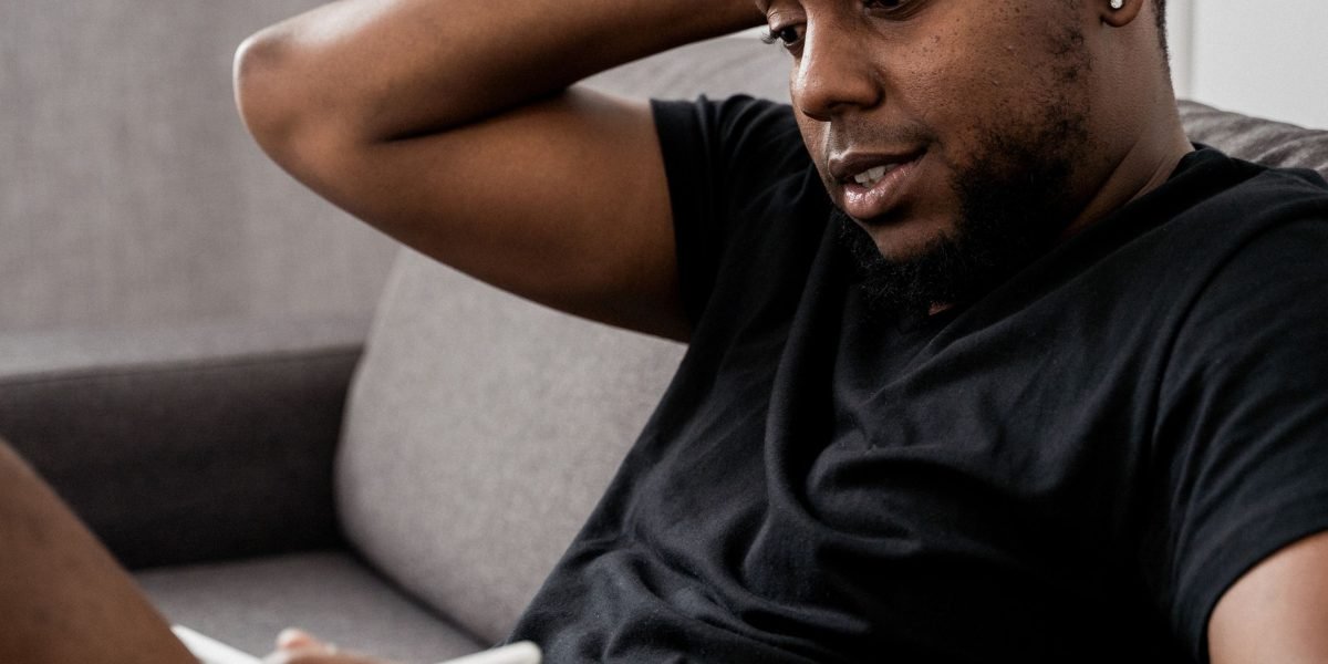 A person feeling isolated and overwhelmed by a constant stream of homogeneous news content.
