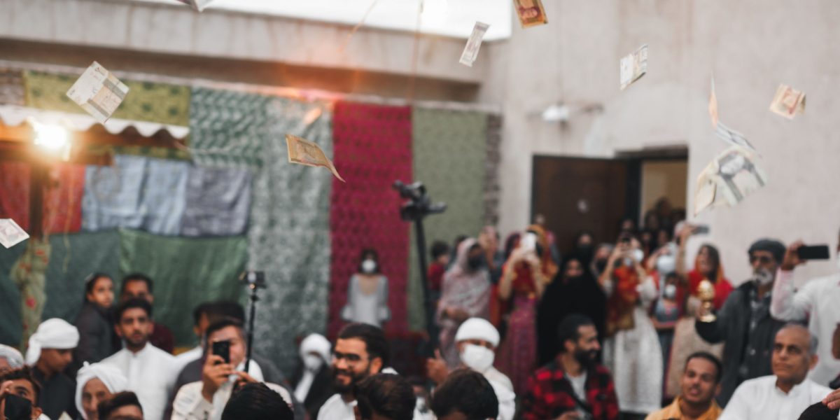 People excitedly interacting with an art installation or event, embodying the participation in experiential advertising.
