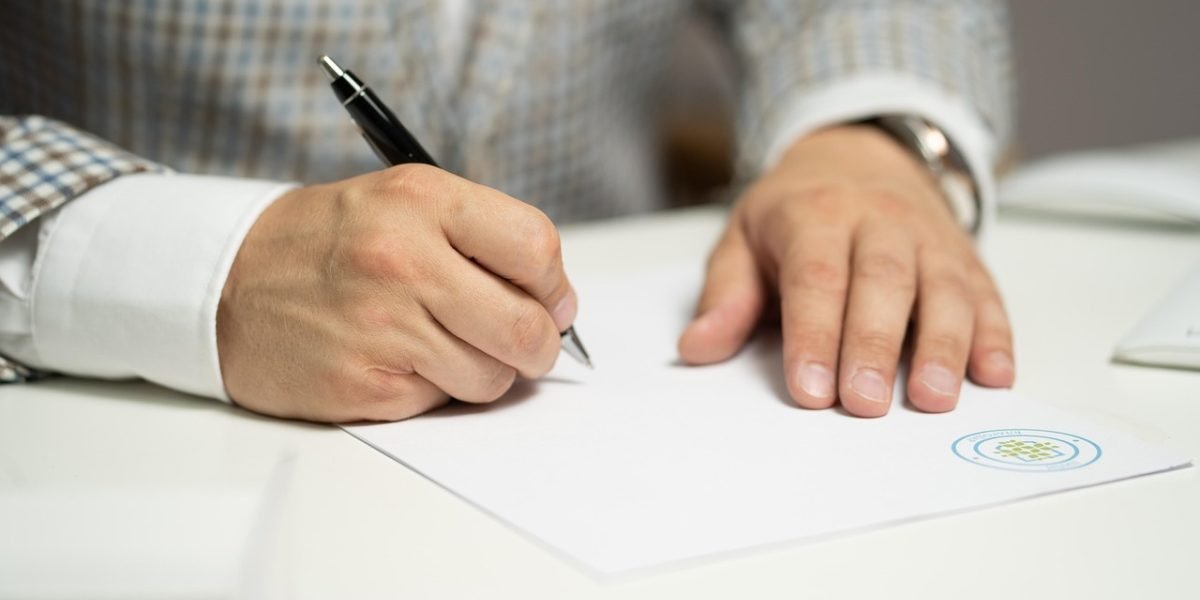 An individual deeply engrossed in analyzing documents and critically evaluating information.