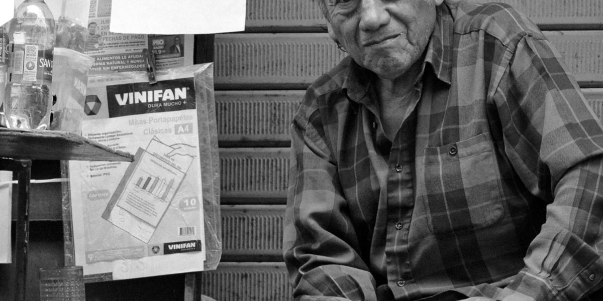 A person reflecting on an advertisement, showcasing thoughtful engagement with media.