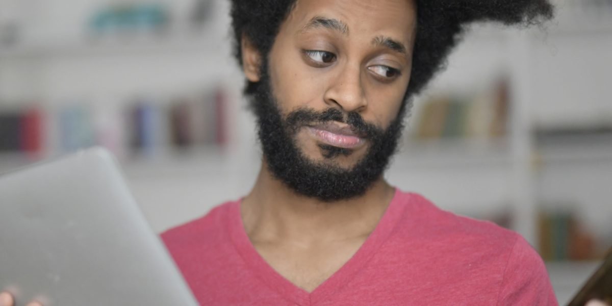 A person looking overwhelmed, symbolizing the widespread confusion caused by information overload and misinformation.