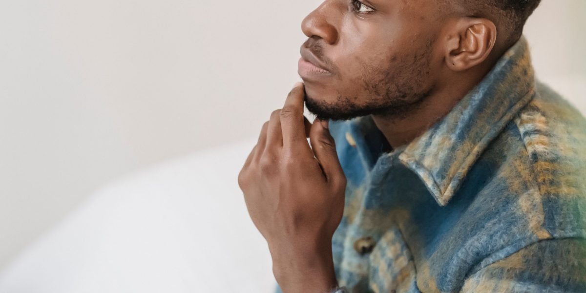 An individual contemplates different career or educational paths, considering factors like budget, time, and learning style.
