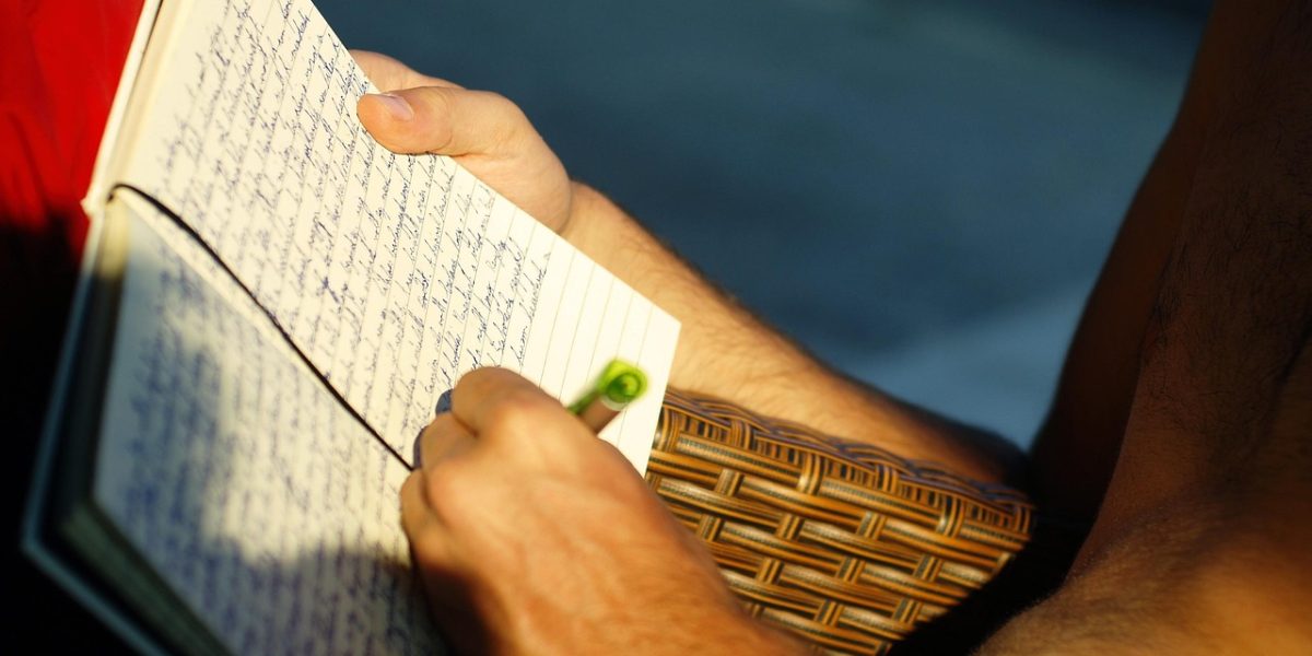 A person independently learning and taking notes, embodying the process of building a personalized news literacy tool.