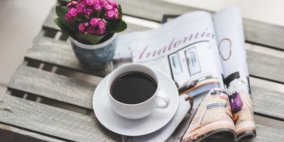 A diverse group of people, including individuals with varied reading abilities or preferences, enjoying accessible print magazines.