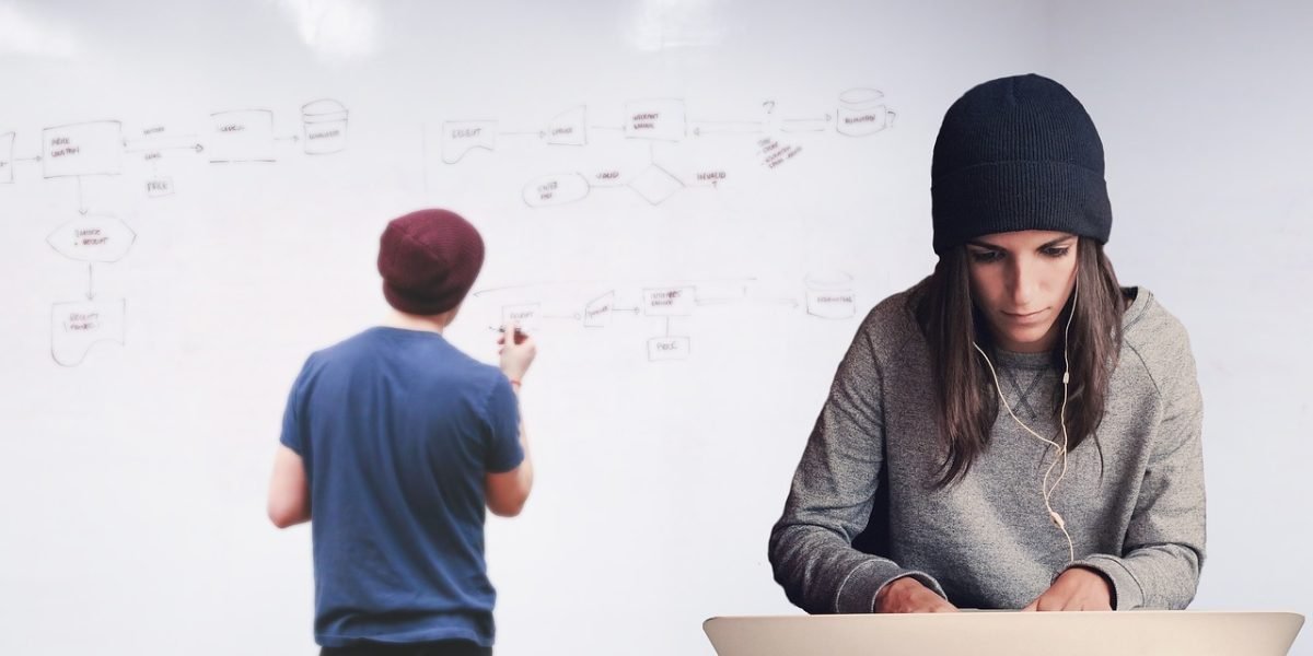 A team collaboratively analyzing data on a whiteboard, reflecting the process of understanding reader behavior from email testing metrics.