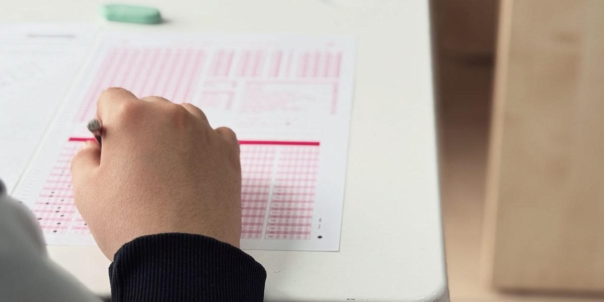 A person meticulously evaluating different options, symbolizing the careful choice of data visualization tools.