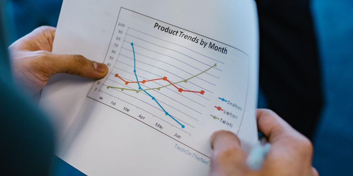 A team of professionals collaboratively reviewing and refining data visualizations, emphasizing the iterative process.