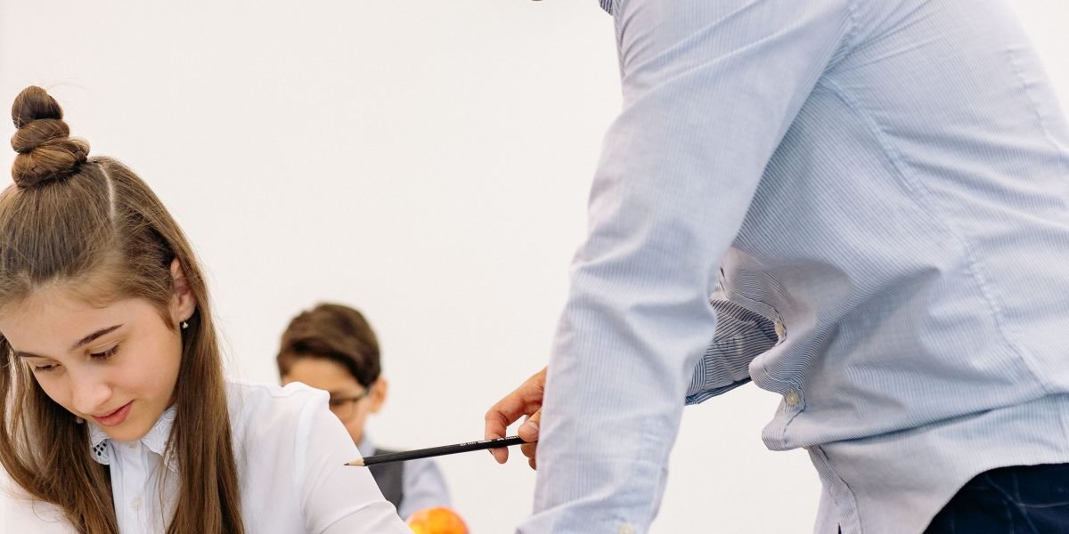 An educator guides students through activities designed to enhance their media literacy skills.